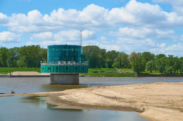 Gruba Kaska "u2013 water filtration station on the Vistula river in Warsaw. Panorama overlooking the river and sand on the shore