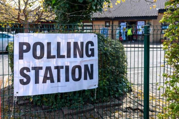 Polling station signs in UK Polling Station signs outside a school in the UK. polling place photos stock pictures, royalty-free photos & images