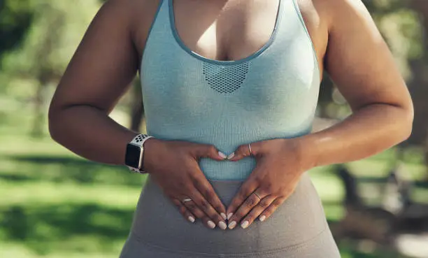 Photo of Shot of a woman resting during a workout