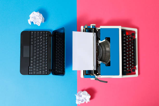 istock Digital und analog – Laptop and 80s Typewriter 1321288209