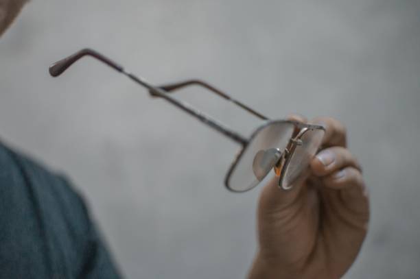 istock Close-Up Hand holding glasses 1321292714