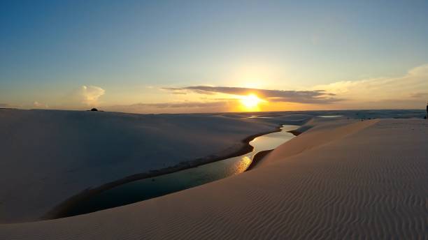 Lencois Maranhenses National Park, Maranhao, Brazil. Sand dunes and rainwater lakes landscape. Lencois Maranhenses National Park, Maranhao, Brazil. Sunset at sandy mountains of Lencois Maranhenses. Barreirinhas, Maranhao, Brazil. Tropical scenery vacations on exotic destination. Lençois Maranhenses National Park, Maranhao, Brazil. Sand dunes and rainwater lakes landscape. Brazil Northeast. brazil desert maranhao state national park stock pictures, royalty-free photos & images