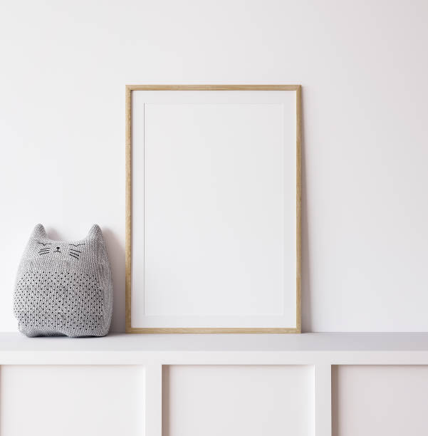 istock Poster mockup in minimal nursery design, wooden frame on white interior background 1321295173