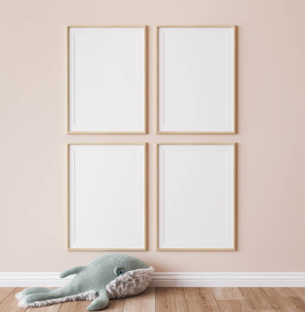 Poster mockup in minimal nursery design, wooden frames on beige interior background stock photo