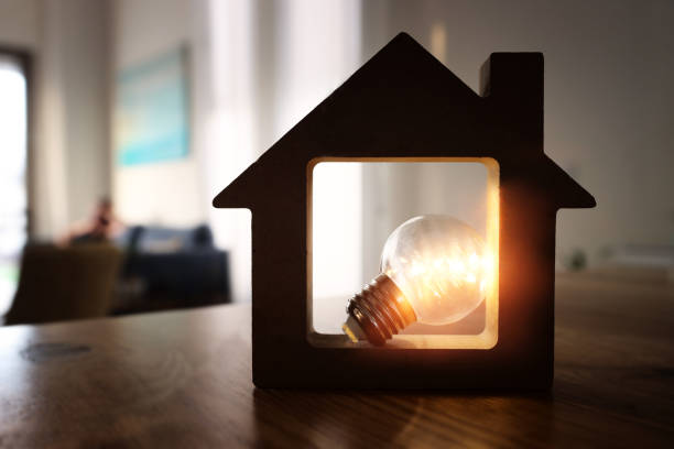 istock Wood house with Light bulb. energy concept or invention 1321295324