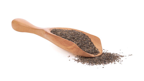 istock Dry black tea leaves isolated on white background. 1321296953