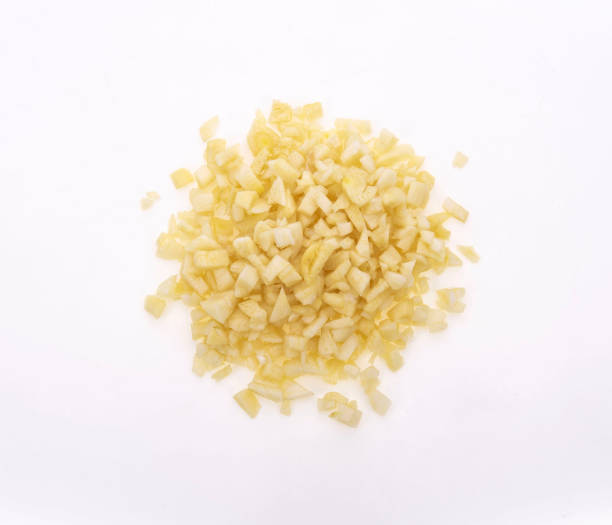 istock Fresh sliced garlic isolated on white background 1321296957