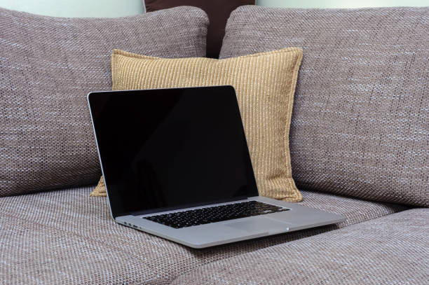 istock View on a laptop pc on the sofa in a home office 1321301227