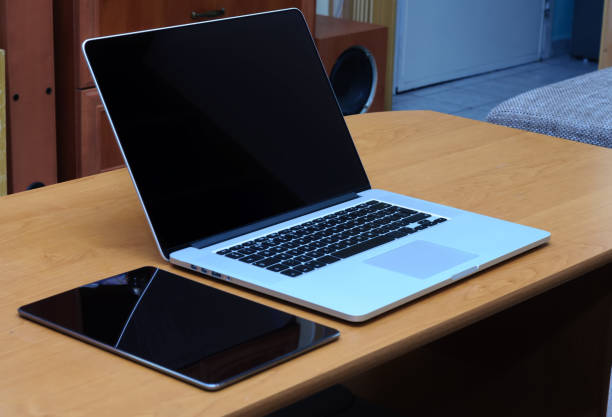 istock View on a laptop pc and a tablet on a desk in a home office 1321301339