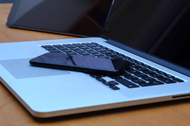 istock View on a laptop pc and a smartphone and a tablet on a desk in a home office 1321301882