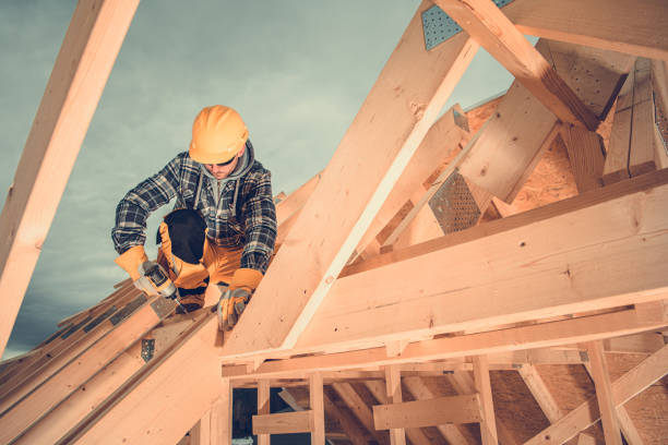 istock Wooden House Roof Beams Assembly by Construction Worker 1321305423