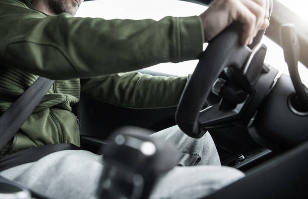 istock Caucasian Men Behind the Car Wheel 1321306252