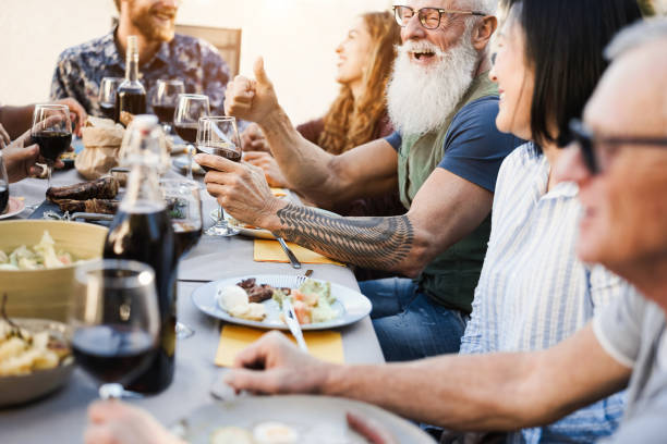 istock Multi generational people having fun at barbecue patio dinner - Focus on hipster man face 1321306537