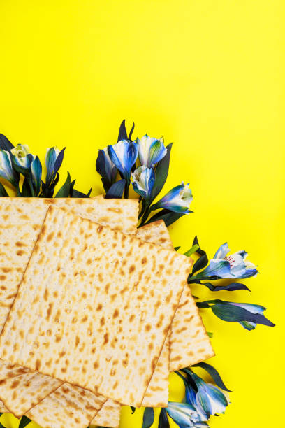 istock Passover background with matzah and blue flowers. 1321306574