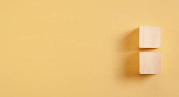 istock Wooden cubes on yellow background. 1321306884