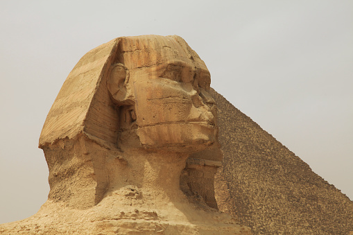 View of Great Sphinx of Giza in front of Pyramid of Giza, Giza Pyramid Complex, Giza, Cairo, Egypt.