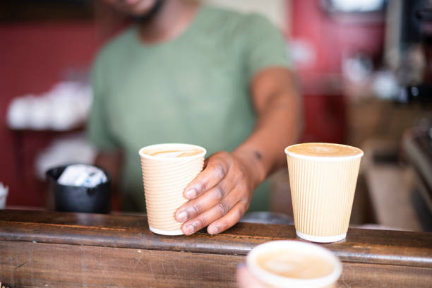 istock Selective focus barista hands take away coffee to customer 1321311377