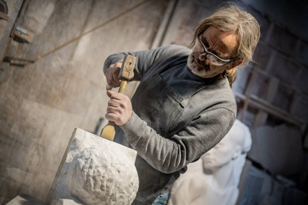 istock Stonemason carving a sculpture in the workshop 1321311539