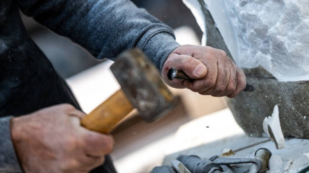 istock Stonemason carving a sculpture in the workshop 1321311548