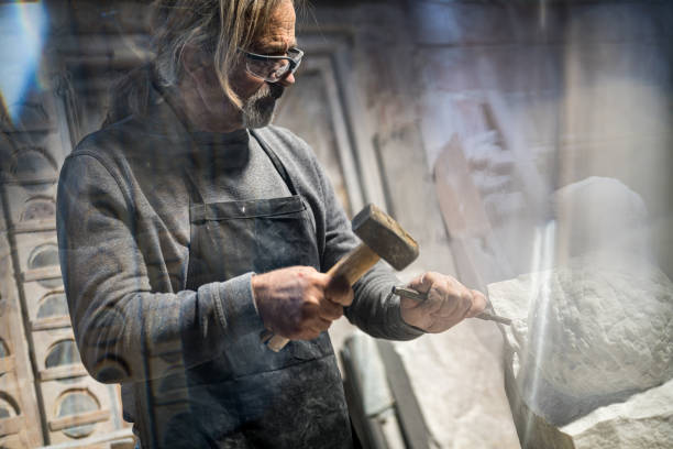 istock Stonemason carving a sculpture in the workshop 1321311553