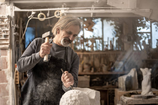istock Stonemason carving a sculpture in the workshop 1321311562