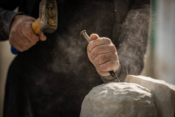 istock Stonemason carving a sculpture in the workshop 1321311572