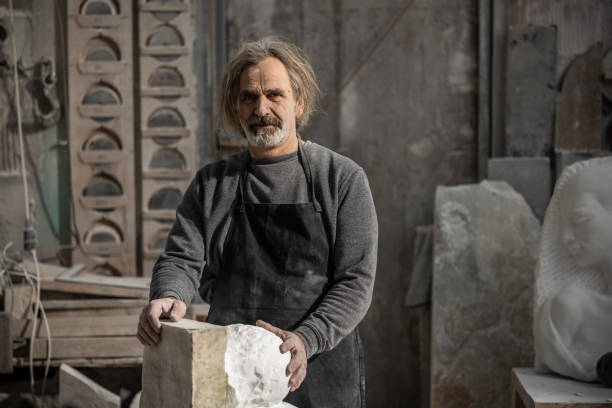 istock Portrait of a smiling stonemason in the workshop 1321311577