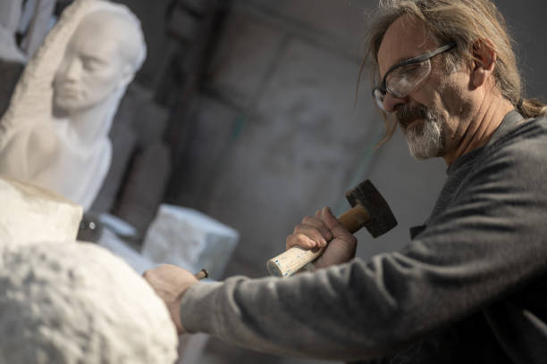 istock Stonemason carving a sculpture in the workshop 1321311578