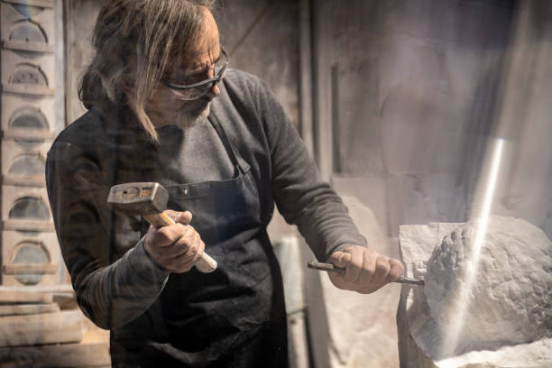 istock Stonemason carving a sculpture in the workshop 1321311585