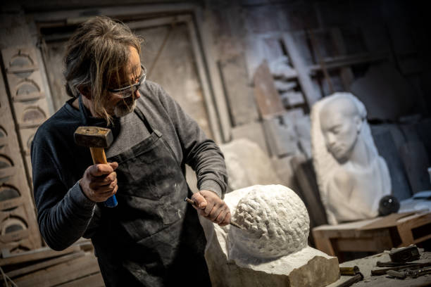 istock Stonemason carving a sculpture in the workshop 1321311596