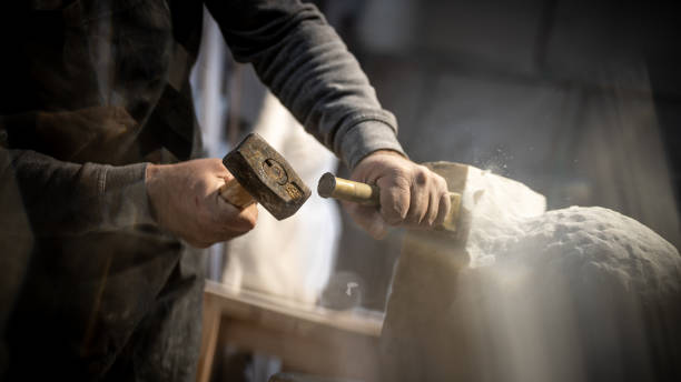 istock Stonemason carving a sculpture in the workshop 1321311605
