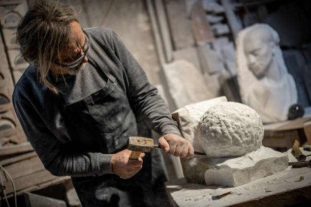 istock Stonemason carving a sculpture in the workshop 1321311611