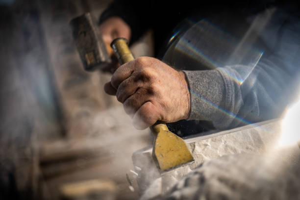 istock Stonemason carving a sculpture in the workshop 1321311613