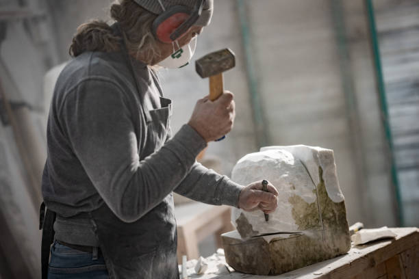 istock Stonemason carving a sculpture in the workshop 1321311618