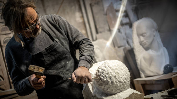 istock Stonemason carving a sculpture in the workshop 1321311619