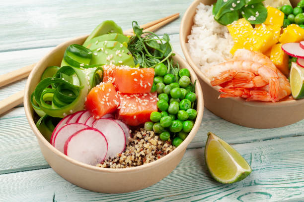 istock Poke bowls with shrimps, salmon, avocado and mango 1321312379