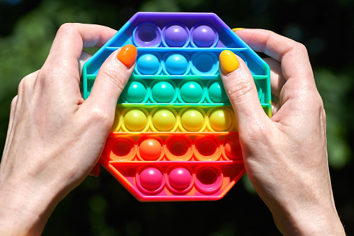 Stacking and counting game wooden pieces on table indoors, space for text. Educational toy for motor skills development