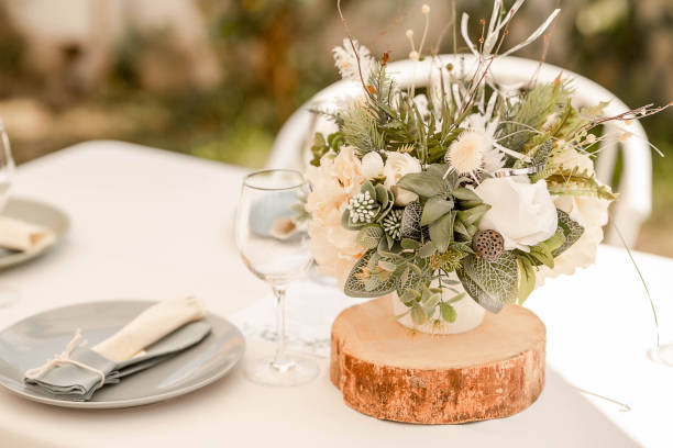 istock Table arrangement with natural rustic notes featuring herbal floral centerpieces, soft linen table cloth and pastel details 1321312964