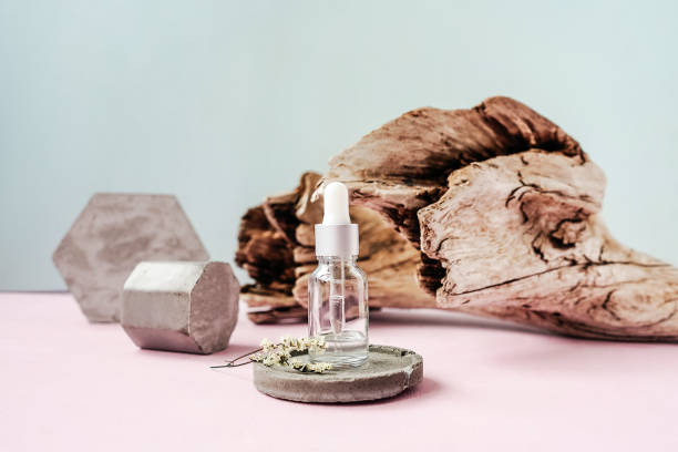 istock Front view of face serum bottle. Concrete. 1321313817
