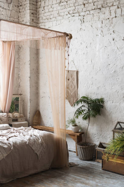 istock Big bed with baldachin in boho chic bedroom 1321314679