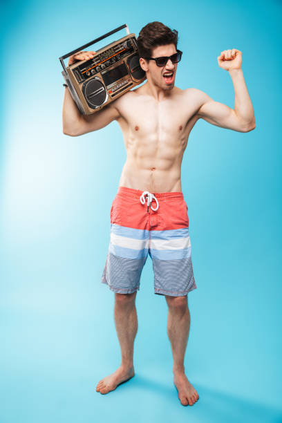 istock Full length portrait if a cheerful shirtless man 1321316100