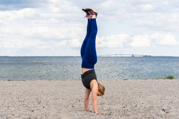 istock Young woman exercise on Copenhagen beach 1321317600