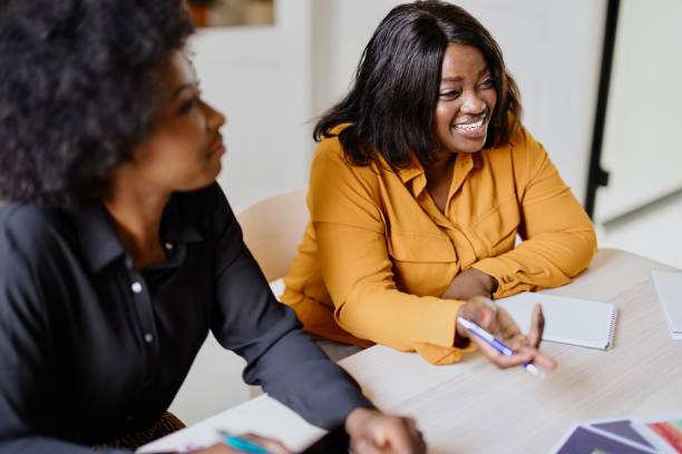 istock Business people discussing graphs on the table with female boss team leader 1321318873