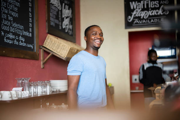 istock Candid portrait happy African cafe owner 1321319487