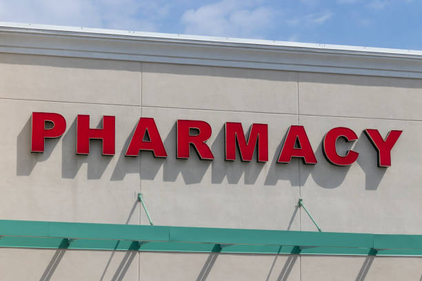 istock Pharmacy isolated sign, red letters and beige background. 1321320649