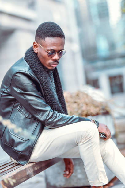 istock Modern African Male Siting On Bench Waiting For Cab 1321323677