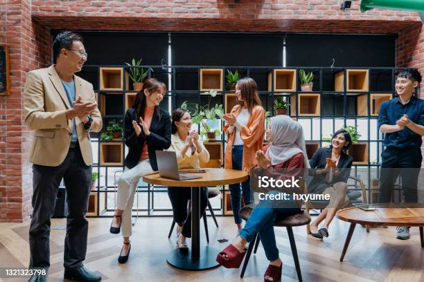 Cheerful Asian Business Professionals In Modern Office Stock Photo - Download Image Now