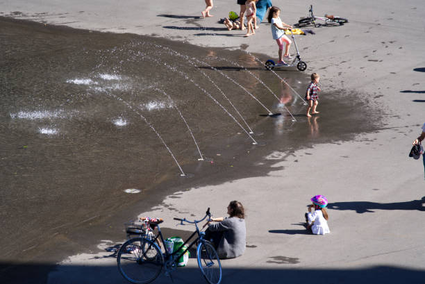 Child drinking from a water fountain.
