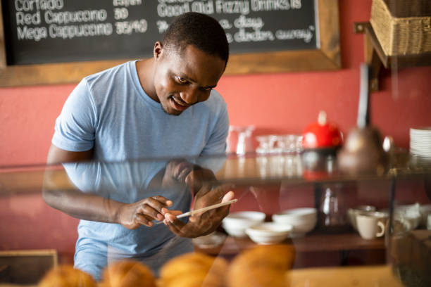 istock African coffee shop manager checking inventory 1321330008
