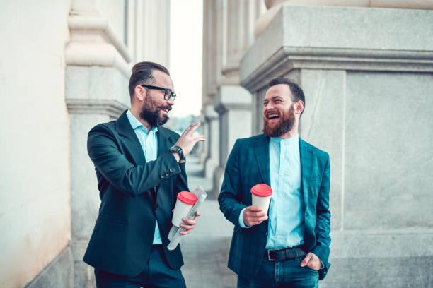 istock Two Businessmen Drinking Great Coffee And Relaxing Outside 1321331500
